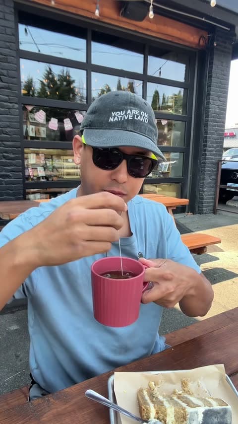 The creator behind Seattle Foodie Adventure tasting food at a local café